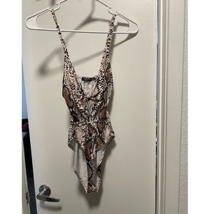 Snake print body suit with key hole cut out